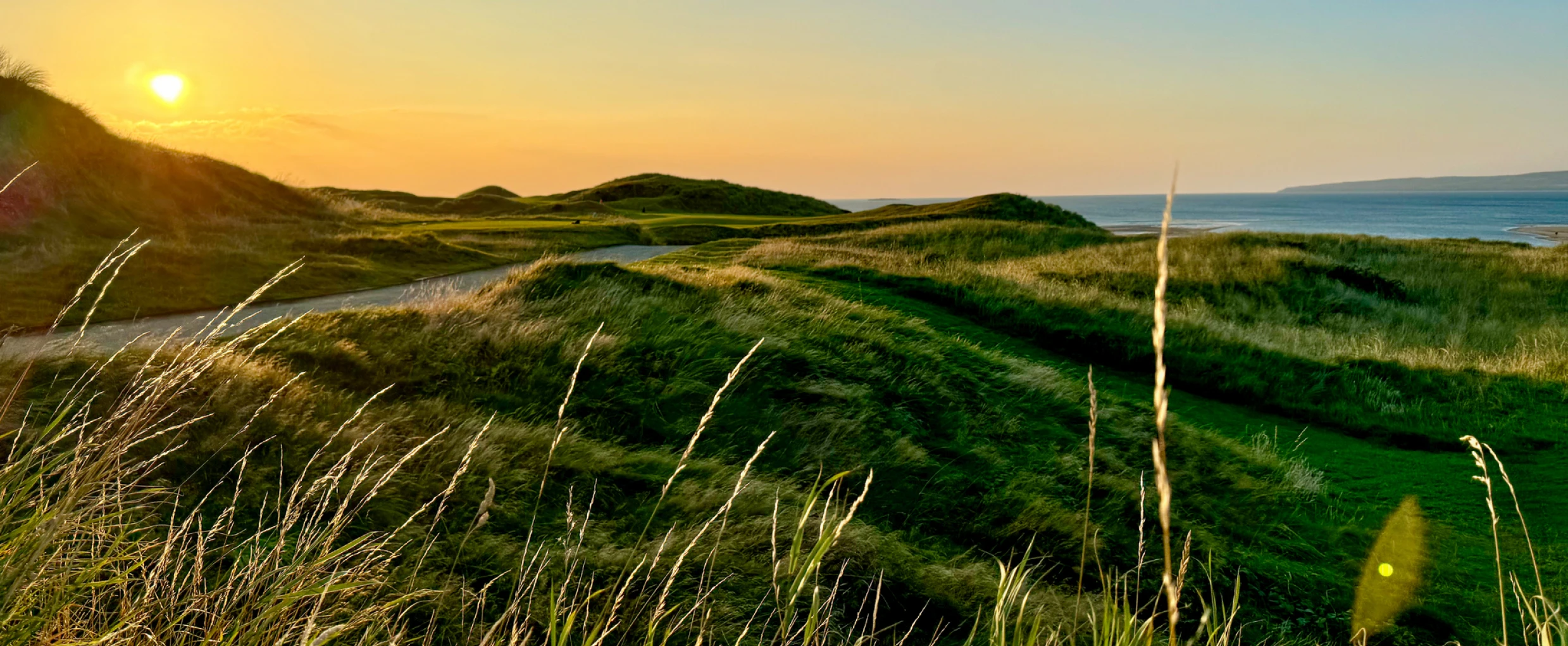 Coastal landscape with golden sunset